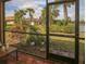 Spacious screened patio with brick flooring and tranquil backyard view at 6730 Haverhill Ct, Bradenton, FL 34202