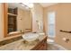 Updated bathroom with granite vanity, vessel sink, and walk-in shower at 6790 Paseo Castille, Sarasota, FL 34238