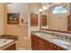 Bathroom with granite double vanity and soaking tub at 6790 Paseo Castille, Sarasota, FL 34238