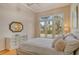 Bright bedroom with pool view and wood floors at 6790 Paseo Castille, Sarasota, FL 34238