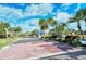 Attractive community entrance with landscaping and guardhouse at 6790 Paseo Castille, Sarasota, FL 34238