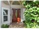 Elegant front door with a glass oval window and sidelights at 6790 Paseo Castille, Sarasota, FL 34238