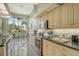 Well-equipped kitchen featuring stainless steel appliances and granite counters at 6790 Paseo Castille, Sarasota, FL 34238