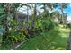 Landscaped yard showcasing tropical plants and greenery at 6790 Paseo Castille, Sarasota, FL 34238