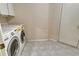 Laundry room with washer and dryer and exterior access at 6790 Paseo Castille, Sarasota, FL 34238