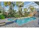 Screened pool and spa with brick pavers and lush landscaping at 6790 Paseo Castille, Sarasota, FL 34238