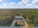 Wide shot of house and surrounding landscape at 7041 Alan Blvd, Punta Gorda, FL 33982