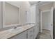 Double vanity bathroom with white cabinets and mirrors at 7041 Alan Blvd, Punta Gorda, FL 33982