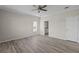 Spacious bedroom with wood-look floors and ceiling fan at 7041 Alan Blvd, Punta Gorda, FL 33982