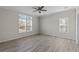 Bright bedroom with wood-look floors and lots of natural light at 7041 Alan Blvd, Punta Gorda, FL 33982