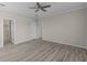 Spacious bedroom with wood-look floors and access to bathroom at 7041 Alan Blvd, Punta Gorda, FL 33982