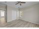 Bright bedroom with wood-look floors and a window with blinds at 7041 Alan Blvd, Punta Gorda, FL 33982