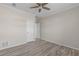 Bright bedroom featuring wood-look floors and ample closet space at 7041 Alan Blvd, Punta Gorda, FL 33982