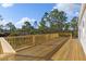 Spacious deck with wooden railings offers scenic views at 7041 Alan Blvd, Punta Gorda, FL 33982