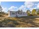 Single-story manufactured home with light gray siding and a white base at 7041 Alan Blvd, Punta Gorda, FL 33982