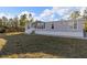 Single-story manufactured home with light gray siding and a white base at 7041 Alan Blvd, Punta Gorda, FL 33982