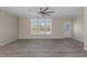 Bright living room featuring hardwood floors and large windows at 7041 Alan Blvd, Punta Gorda, FL 33982