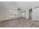 Bright living room with gray vinyl flooring and neutral wall colors at 7041 Alan Blvd, Punta Gorda, FL 33982