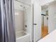 Simple bathroom with shower/tub and gray curtain at 7117 Queen Palm Cir, Sarasota, FL 34243