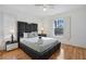 Cozy bedroom with full bed and wood flooring at 7117 Queen Palm Cir, Sarasota, FL 34243