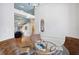 Cozy dining nook with a glass-top table and wicker chairs, overlooking living room at 7117 Queen Palm Cir, Sarasota, FL 34243