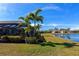 Landscaped backyard with lake view and lush greenery at 7123 Marsh View Terrace Ter, Bradenton, FL 34212