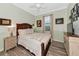 Guest bedroom with a queen bed, and hardwood floors at 7123 Marsh View Terrace Ter, Bradenton, FL 34212