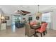 Bright dining room features a rustic wood table and chairs, and opens to the living room at 7123 Marsh View Terrace Ter, Bradenton, FL 34212