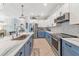 Modern kitchen with blue cabinets, white countertops, and breakfast bar at 7123 Marsh View Terrace Ter, Bradenton, FL 34212