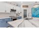 Modern kitchen with blue cabinets, white countertops, and stainless steel appliances at 7123 Marsh View Terrace Ter, Bradenton, FL 34212