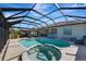 Relaxing pool and spa with covered patio and outdoor kitchen at 7123 Marsh View Terrace Ter, Bradenton, FL 34212