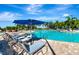 Relaxing pool area with lounge chairs and umbrellas at 7123 Marsh View Terrace Ter, Bradenton, FL 34212