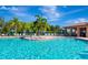 Inviting swimming pool with surrounding lounge chairs and palm trees at 7123 Marsh View Terrace Ter, Bradenton, FL 34212