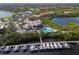 Aerial view of community, featuring clubhouse, marina, and lush landscape at 735 Foggy Morn Ln, Bradenton, FL 34212