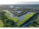 Aerial view of golf course community near waterway at 735 Foggy Morn Ln, Bradenton, FL 34212