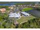 Aerial view of community, showing clubhouse, putting green and waterfront at 735 Foggy Morn Ln, Bradenton, FL 34212