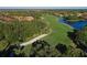 Aerial view of lush golf course and lakefront homes at 735 Foggy Morn Ln, Bradenton, FL 34212