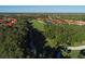 Aerial view of community with golf course and lake at 735 Foggy Morn Ln, Bradenton, FL 34212