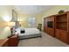 Spacious bedroom with wood furniture and neutral decor at 735 Foggy Morn Ln, Bradenton, FL 34212