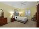 Bright bedroom with plush carpeting and a ceiling fan at 735 Foggy Morn Ln, Bradenton, FL 34212