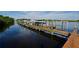 Wooden boat docks extending over calm water, offering convenient boat access at 735 Foggy Morn Ln, Bradenton, FL 34212