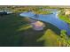 Aerial view of a golf course green next to water at 735 Foggy Morn Ln, Bradenton, FL 34212