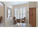 Kitchen nook with glass-top table and built-in cabinetry at 735 Foggy Morn Ln, Bradenton, FL 34212