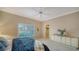 Bedroom with view of a window, a chest of drawers, and walk-in closet at 7412 Links Ct, Sarasota, FL 34243