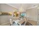 Dining room with chandelier and view of adjacent rooms at 7412 Links Ct, Sarasota, FL 34243