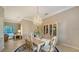 Dining room with chandelier, cabinet, and seating for six at 7412 Links Ct, Sarasota, FL 34243