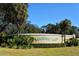 Fairway Lakes community entrance sign with well-manicured landscaping and greenery under a clear, blue sky at 7412 Links Ct, Sarasota, FL 34243