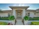 Welcoming front entrance with double doors and manicured landscaping at 7412 Links Ct, Sarasota, FL 34243