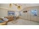 Bright and airy living room with vaulted ceiling, tile flooring, and built-in cabinetry at 7412 Links Ct, Sarasota, FL 34243