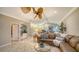 View of living room with open floorplan and a bar area, perfect for social gatherings at 7412 Links Ct, Sarasota, FL 34243